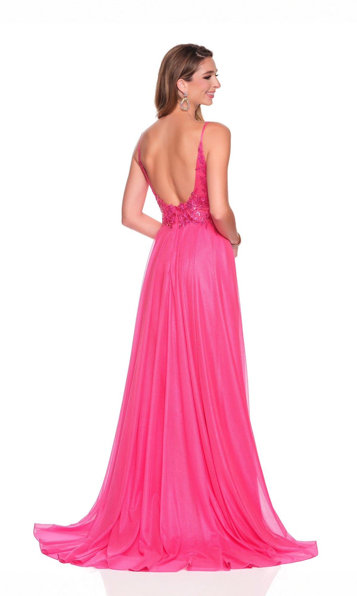A woman stands facing away, wearing the Flowy Hot Pink Prom Dress: Dave and Johnny 12570—a floor-length, sleeveless gown with an embroidered bodice and low open back.